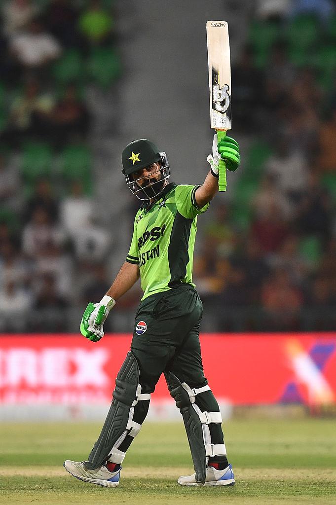 Shadab Khan celebrates his century against England.